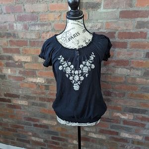 Black peasant style short sleeve blouse.